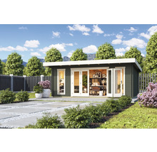 Maison de jardin avec bureau à l'extérieur sur une pelouse.