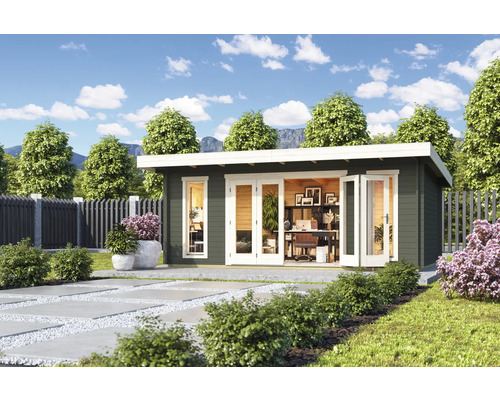 Maison de jardin avec bureau à l'extérieur sur une pelouse.