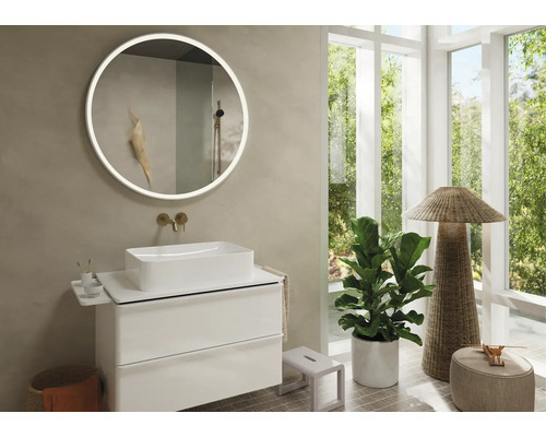 Modernes Badezimmer mit rundem Spiegel, Waschbecken und Waschtisch