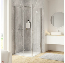 Cabine de douche d''angle avec ensemble de douche, lavabo et miroir dans une salle de bain