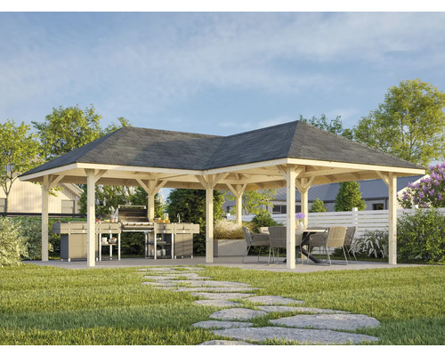 Grand pavillon avec espace barbecue et coin salon dans le jardin.