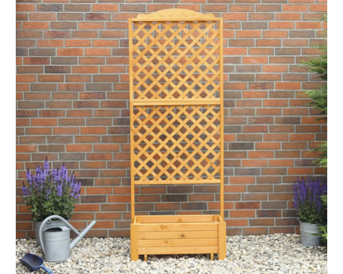 Holz Pflanzkasten mit Rankgitter vor einer Ziegelwand