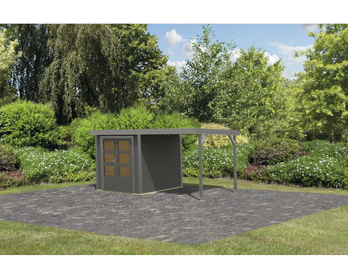 Abri de jardin avec annexe dans le jardin sur sol en pierre