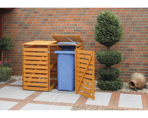 Cache-conteneur à ordures en bois avec une poubelle dans le jardin