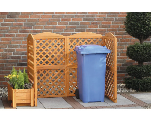 Cache-poubelle en bois avec poubelle et jardinière dans le jardin