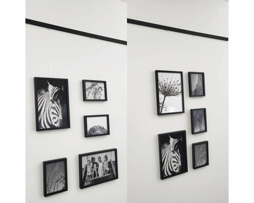 Wanddekoration mit Bilderrahmen an einem Schienensystem