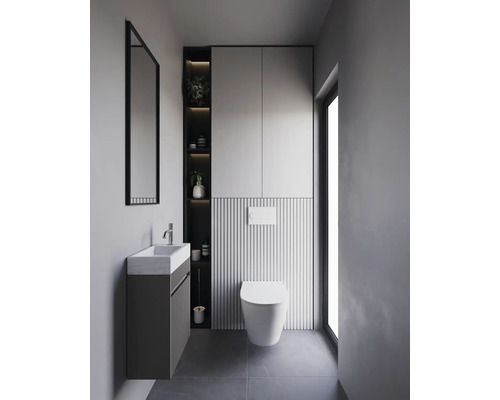 Salle de bains moderne avec lavabo, miroir, toilettes et espace de rangement