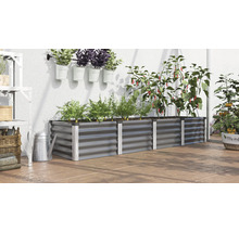 Hochbeet aus Metall mit Pflanzen, Kräutern und Gemüse auf einer Terrasse.
