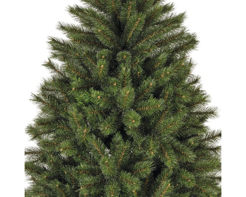 Gros plan d'un sapin de Noël artificiel avec des aiguilles vertes