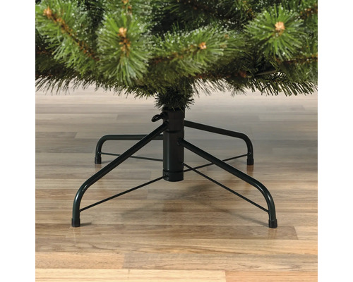 Vue détaillée d'un arbre de Noël artificiel avec support métallique.