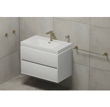 Salle de bain moderne avec meuble sous-vasque blanc, lavabo à poser et robinetterie dorée