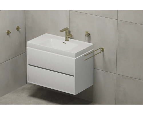 Meuble-lavabo avec deux tiroirs, robinetterie, porte-serviettes et distributeur de savon dans la salle de bain