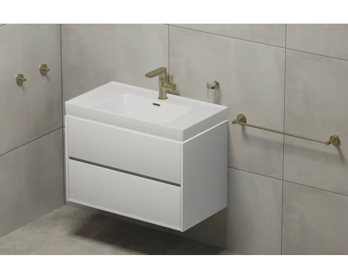 Lavabo avec meuble sous-vasque, robinetterie, distributeur de savon et porte-serviettes dans la salle de bains