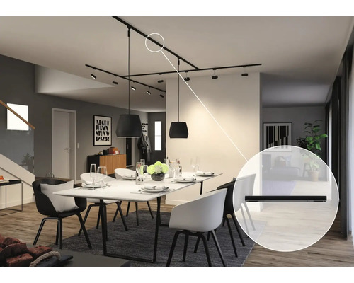 Salle à manger avec table à manger, chaises et système de rails noirs au plafond