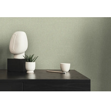 Gros plan d''un papier peint textile vert dans le salon