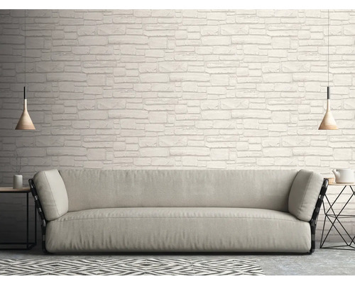 Salon avec canapé et papier peint mural imitation pierre