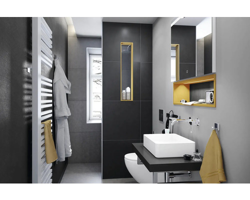 Salle de bains moderne avec lavabo, toilettes et sèche-serviettes
