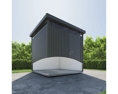 Abri de jardin avec toit plat et terrasse sur sol en pierre