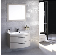 Salle de bain moderne avec meuble-lavabo, miroir et douche.