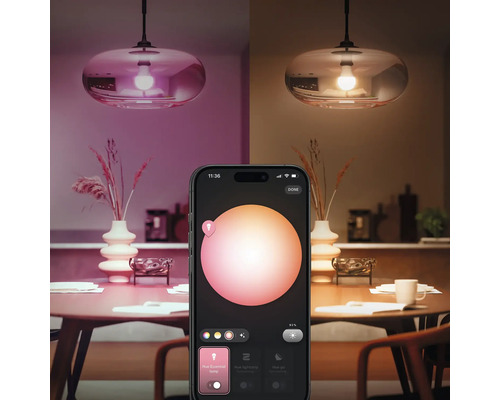 Smarte Lampe mit Steuerung per Smartphone-App über einem Esstisch