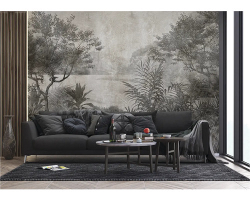 Salon avec canapé gris, table basse et revêtement mural à motif de paysage.