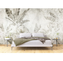 Chambre à coucher avec un papier peint mural à motifs de plantes créant une atmosphère calme.