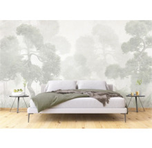 Chambre avec papier peint photo motif forêt derrière un lit
