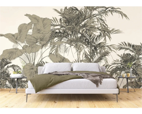 Chambre avec papier peint photo représentant des motifs de plantes tropicales derrière un lit