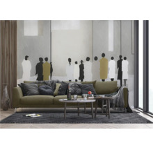 Salon moderne avec canapé, tables basses et décoration murale