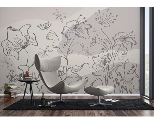 Salon avec papier peint photo floral, fauteuil et table d'appoint