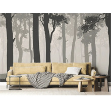 Salon avec canapé et papier peint photo avec motif de forêt