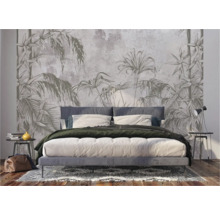 Chambre à coucher avec papier peint jungle derrière le lit