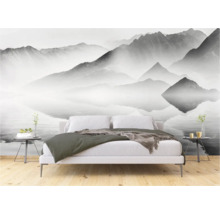 Schlafzimmer mit Fototapete Berglandschaft über dem Bett