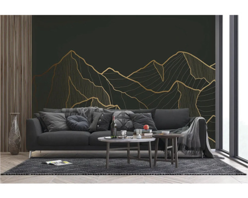 Salon avec canapé, table basse et papier peint mural avec motif de montagne