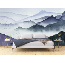Chambre avec un papier peint photo représentant des montagnes