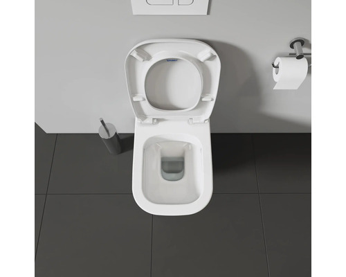 Image de toilettes avec couvercle ouvert et distributeur de papier toilette