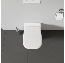 Vue de dessus de toilettes avec dérouleur de papier toilette, plaque de commande et brosse de toilette