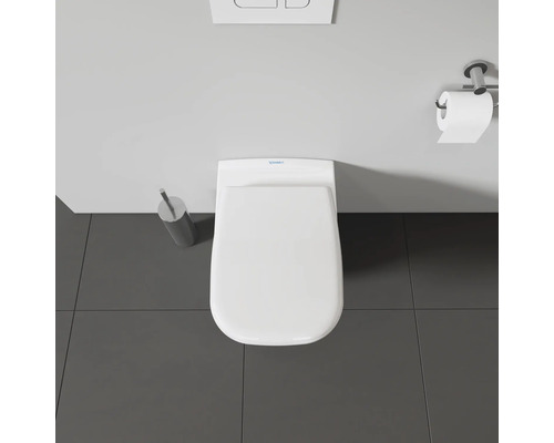 Vue de dessus de toilettes avec dérouleur de papier toilette, plaque de commande et brosse de toilette