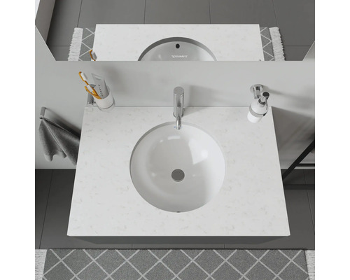 Plan de toilette de salle de bains avec vasque ronde et robinet