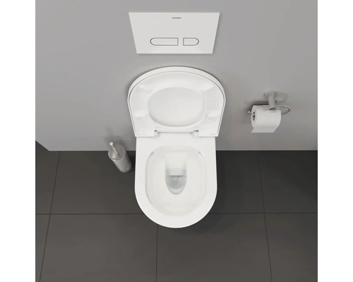 Vue de dessus de toilettes avec couvercle ouvert, brosse de toilettes, porte-papier toilette et logo Duravit