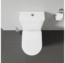 Vue de dessus de toilettes Duravit blanches avec brosse de toilettes et porte-papier hygiénique