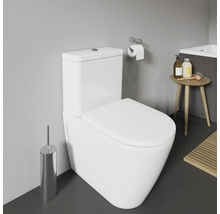 Salle de bain moderne avec toilettes, porte-papier toilette, brosse et tabouret