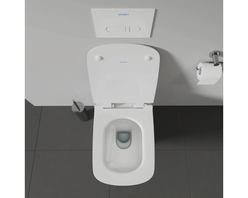 Vue de dessus de toilettes avec réservoir de chasse et porte-papier toilette