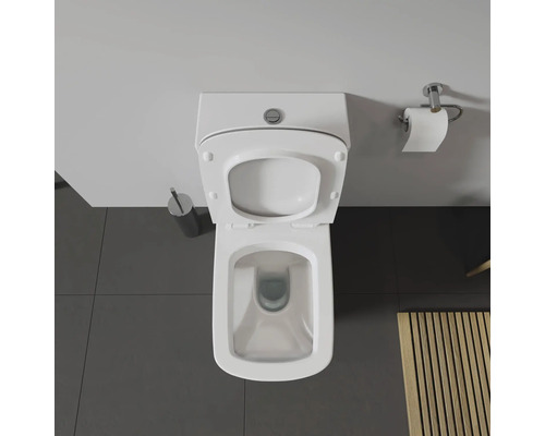 Vue de dessus de toilettes avec couvercle ouvert dans une salle de bains