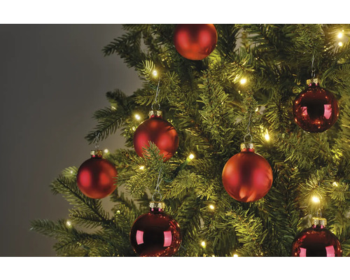 Arbre de Noël décoré avec des boules rouges et des lumières