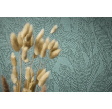 Gros plan d'un papier peint vert avec un motif de feuilles