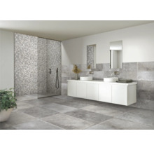 Salle de bains moderne avec carrelage gris, cabine de douche et meuble sous-lavabo