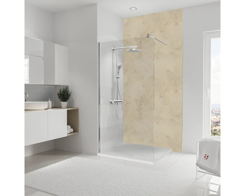 Salle de bains lumineuse avec cabine de douche, lavabo et tapis de bain