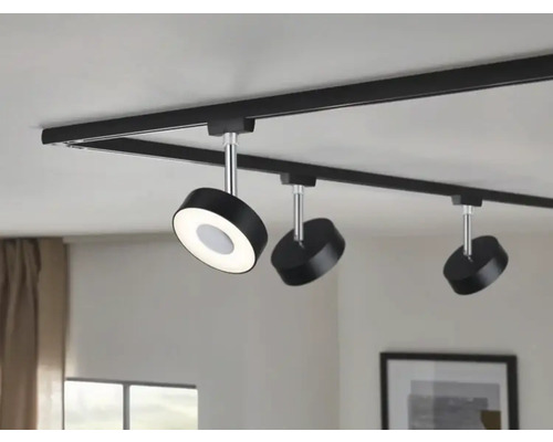 Système de rails noir avec trois spots LED ronds au plafond