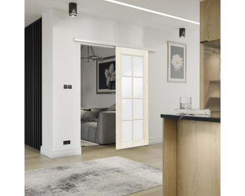 Vue intérieure avec porte coulissante en bois et en verre séparant deux pièces